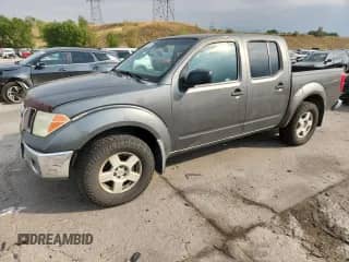 2005 Nissan Frontier Nismo with VIN 1N6AD07W35C430322, listed as a Copart auction lot 71000325 with 298,547 mi miles and Salvage title. Bid and sale history available at DreamBid. Image 1.