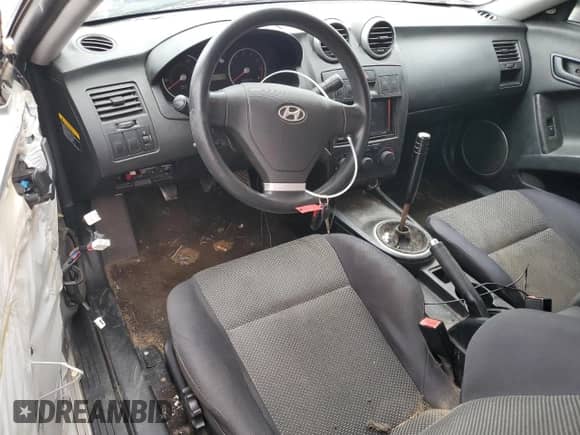 2005 Hyundai Tiburon GS with VIN KMHHM65D05U184230, listed as a Copart auction lot 80068374 with 135,076 mi miles and Salvage title. Bid and sale history available at DreamBid. Image 8.