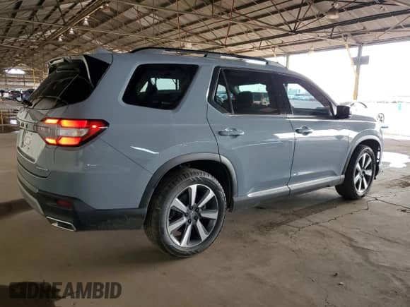 2023 Honda Pilot Touring с VIN 5FNYG1H77PB048953, выставлен на аукционе Copart как лот 70189975 с пробегом 26 433 миль миль и Списание • Salvage title. История ставок и продаж доступна на DreamBid. Изображение 3.