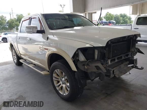 2014 Ram 1500 Longhorn z VIN 1C6RR7PM7ES353935, wystawiony jako IAAI lot #42781639 z przebiegiem 187 049 mil mil oraz . Historia ofert i sprzedaży dostępna na DreamBid. Obrazek 1.