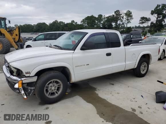 1999 Dodge Dakota SLT z VIN 1B7GL22X2XS106718, wystawiony jako Copart lot #70169105 z przebiegiem 291 180 mil mil oraz Szkoda całkowita • Salvage title. Historia ofert i sprzedaży dostępna na DreamBid. Obrazek 1.