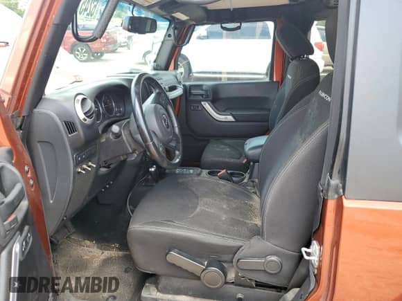 2014 Jeep Wrangler Rubicon with VIN 1C4BJWCG7EL221506, listed as a Copart auction lot 62457345 with 69,606 mi miles and Salvage title. Bid and sale history available at DreamBid. Image 7.