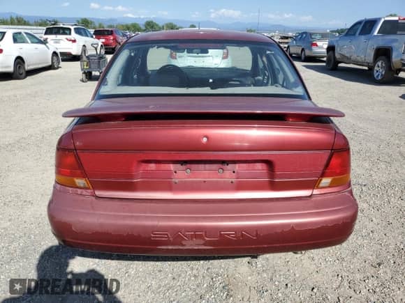 1996 Saturn SL with VIN 1G8ZK5278TZ334649, listed as a Copart auction lot 54098725 with 156,012 mi miles and Salvage title. Bid and sale history available at DreamBid. Image 6.
