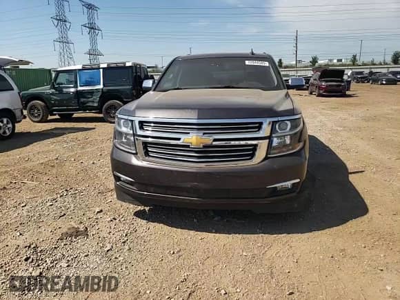 2015 Chevrolet Tahoe LTZ с VIN 1GNSKCKC1FR648891, выставлен на аукционе Copart как лот 72044585 с пробегом 108 125 миль миль и Списание • Salvage title. История ставок и продаж доступна на DreamBid. Изображение 14.