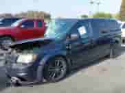 2014 Dodge Grand Caravan SXT with VIN 2C4RDGCG0ER338444, listed as a IAAI auction lot 42332867 with 240,045 mi miles and . Bid and sale history available at DreamBid. Image 2.