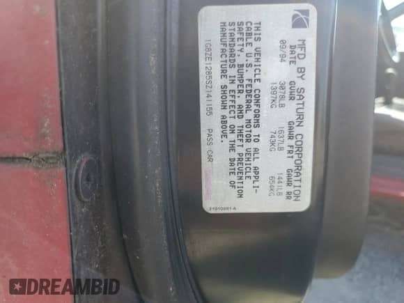 1995 Saturn SC with VIN 1G8ZE1285SZ141155, listed as a Copart auction lot 65757374 with 150,973 mi miles and Salvage title. Bid and sale history available at DreamBid. Image 12.