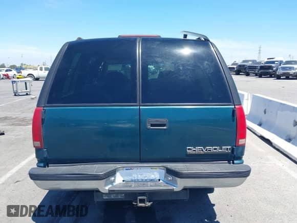 1999 Chevrolet Tahoe z VIN 1GNEC13R9XJ503955, wystawiony jako IAAI lot #42830511 z przebiegiem 185 483 mil mil oraz . Historia ofert i sprzedaży dostępna na DreamBid. Obrazek 16.