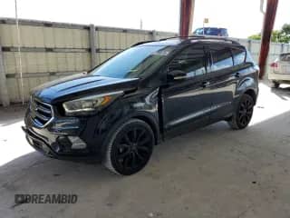 2017 Ford Escape Titanium с VIN 1FMCU0JD0HUE43705, выставлен на аукционе Copart как лот 85735815 с пробегом 69 800 миль миль и Списание • Salvage title. История ставок и продаж доступна на DreamBid. Изображение 1.