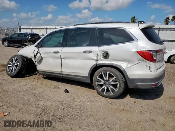 2021 Honda Pilot Touring 7-Passenger with VIN 5FNYF5H62MB011807, listed as a Copart auction lot 64983475 with Not provided miles and Salvage title. Bid and sale history available at DreamBid. Image 2.
