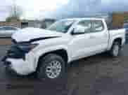 2024 Toyota Tacoma SR5 with VIN 3TMLB5JN5RM010502, listed as a IAAI auction lot 43521054 with 22,894 mi miles and . Bid and sale history available at DreamBid. Image 2.