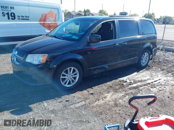 2013 Dodge Grand Caravan SXT with VIN 2C4RDGCG5DR601476, listed as a IAAI auction lot 43399330 with 142,142 mi miles and . Bid and sale history available at DreamBid. Image 2.