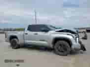 2023 Toyota Tundra SR5 with VIN 5TFLA5DAXPX063117, listed as a Copart auction lot 50590875 with 60,409 mi miles and Salvage title. Bid and sale history available at DreamBid. Image 4.