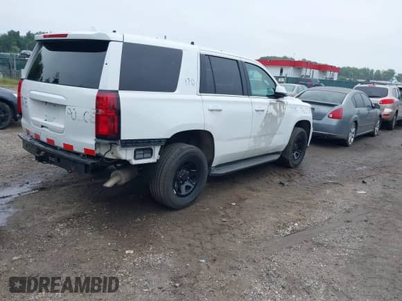2017 Chevrolet Tahoe Commercial with VIN 1GNSKDEC9HR317528, listed as a IAAI auction lot 43043267 with 124,135 mi miles and . Bid and sale history available at DreamBid. Image 4.
