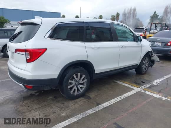 2020 Honda Pilot EX z VIN 5FNYF5H34LB019069, wystawiony jako IAAI lot #41538583 z przebiegiem 55 424 mil mil oraz . Historia ofert i sprzedaży dostępna na DreamBid. Obrazek 4.