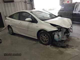 2018 Toyota Prius Two Eco z VIN JTDKARFU4J3063431, wystawiony jako IAAI lot #43575943 z przebiegiem 145 140 mil mil oraz . Historia ofert i sprzedaży dostępna na DreamBid. Obrazek 1.