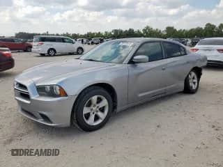 2013 Dodge Charger SE с VIN 2C3CDXBG7DH571785, выставлен на аукционе Copart как лот 86125075 с пробегом 236 717 миль миль и Списание • Salvage title. История ставок и продаж доступна на DreamBid. Изображение 1.
