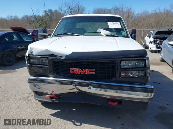 1996 GMC Sierra 1500 z VIN 1GTGC33R4TF018147, wystawiony jako IAAI lot #41612770 z przebiegiem 106 443 mil mil oraz . Historia ofert i sprzedaży dostępna na DreamBid. Obrazek 12.