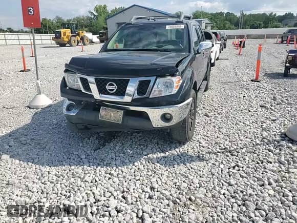 2010 Nissan Frontier LE with VIN 1N6AD0EV5AC418385, listed as a Copart auction lot 70004095 with 88,919 mi miles and Salvage title. Bid and sale history available at DreamBid. Image 13.