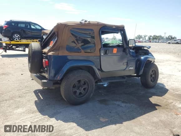 2003 Jeep Wrangler X z VIN 1J4FA39S43P357281, wystawiony jako Copart lot #67979335 z przebiegiem Nie podano mil oraz Szkoda całkowita • Salvage title. Historia ofert i sprzedaży dostępna na DreamBid. Obrazek 3.