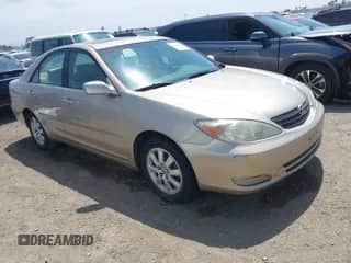 2002 Toyota Camry LE z VIN JTDBE32K320070184, wystawiony jako IAAI lot #42404821 z przebiegiem 252 580 mil mil oraz . Historia ofert i sprzedaży dostępna na DreamBid. Obrazek 1.