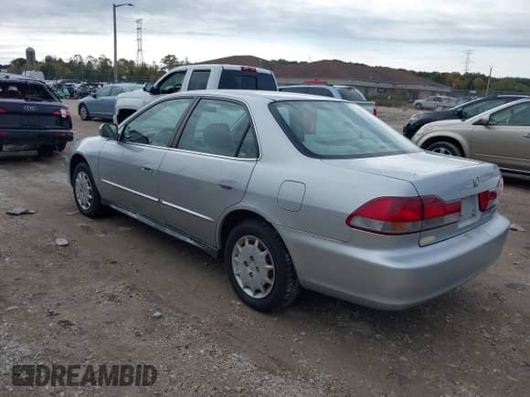 2002 Honda Accord LX with VIN 1HGCG56412A080391, listed as a IAAI auction lot 43441589 with 124,833 mi miles and . Bid and sale history available at DreamBid. Image 3.