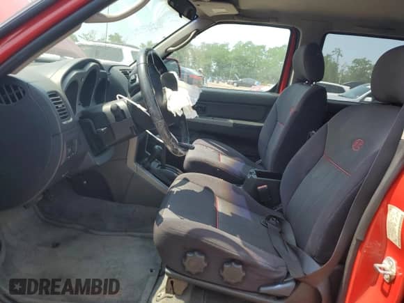 2004 Nissan Frontier SC with VIN 1N6MD29Y34C411968, listed as a Copart auction lot 60550345 with 135,805 mi miles and Salvage title. Bid and sale history available at DreamBid. Image 7.