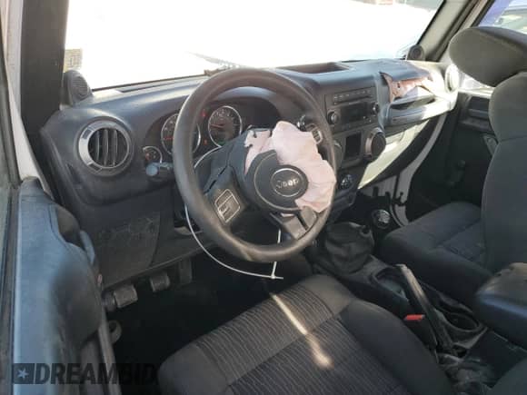 2012 Jeep Wrangler Sport with VIN 1C4AJWAG5CL220348, listed as a Copart auction lot 69854545 with 124,454 mi miles and Salvage title. Bid and sale history available at DreamBid. Image 8.
