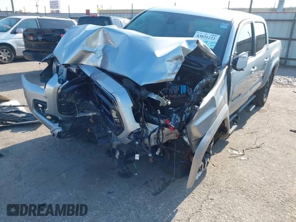 2022 Toyota Tacoma SR5 with VIN 3TMAZ5CN3NM194543, listed as a IAAI auction lot 43031222 with 21,800 mi miles and . Bid and sale history available at DreamBid. Image 2.