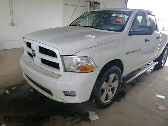 2012 Ram 1500 Express z VIN 1C6RD7FTXCS134228, wystawiony jako Copart lot #67399775 z przebiegiem 98 752 mil mil oraz Szkoda całkowita • Salvage title. Historia ofert i sprzedaży dostępna na DreamBid. Obrazek 13.