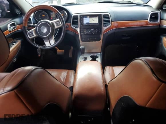 2012 Jeep Grand Cherokee Overland with VIN 1C4RJECG7CC177190, listed as a Copart auction lot 64283025 with 171,511 mi miles and Salvage title. Bid and sale history available at DreamBid. Image 8.