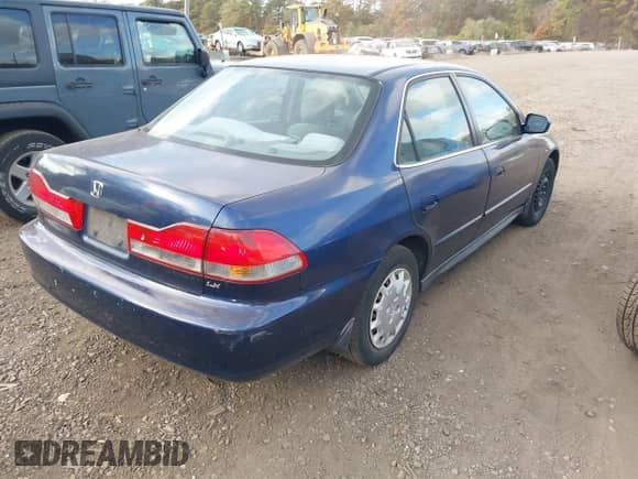 2002 Honda Accord LX with VIN 1HGCG66552A113262, listed as a IAAI auction lot 43532396 with 130,871 mi miles and . Bid and sale history available at DreamBid. Image 4.