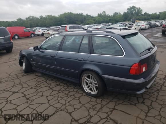 2001 BMW 5 Series 525i with VIN WBADS43441GD84598, listed as a Copart auction lot 63105485 with 205,708 mi miles and Salvage title. Bid and sale history available at DreamBid. Image 2.