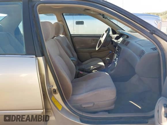 1999 Toyota Camry LE z VIN JT2BF28K7X0215290, wystawiony jako IAAI lot #43498604 z przebiegiem 166 636 mil mil oraz . Historia ofert i sprzedaży dostępna na DreamBid. Obrazek 5.