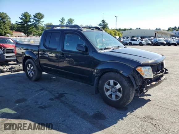 2011 Nissan Frontier Pro-4X with VIN 1N6AD0EVXBC438553, listed as a Copart auction lot 70475845 with Not provided miles and Salvage title. Bid and sale history available at DreamBid. Image 4.