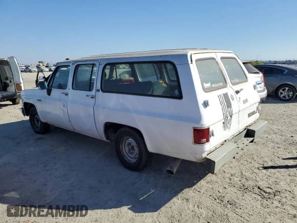 1990 Chevrolet Suburban с VIN 1GNER16K4LF170705, выставлен на аукционе Copart как лот 75886154 с пробегом 223 077 миль миль и Чистый • Clean title. История ставок и продаж доступна на DreamBid. Изображение 2.