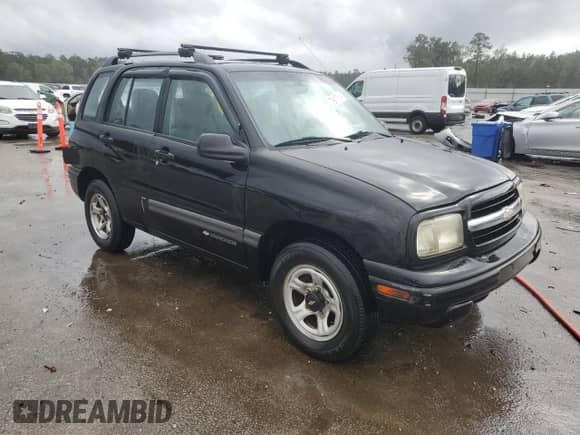2000 Chevrolet Tracker with VIN 2CNBJ13C2Y6908949, listed as a Copart auction lot 79817914 with 212,369 mi miles and Salvage title. Bid and sale history available at DreamBid. Image 4.