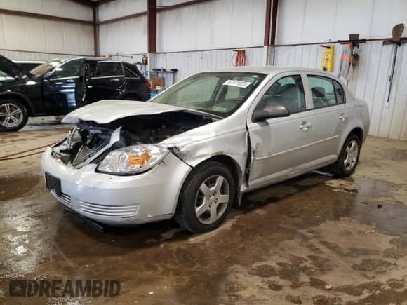2005 Chevrolet Cobalt with VIN 1G1AK52F557596386, listed as a Copart auction lot 67971025 with 115,554 mi miles and Salvage title. Bid and sale history available at DreamBid. Image 1.