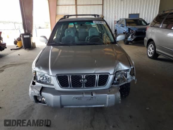 2002 Subaru Forester S with VIN JF1SF65602H712543, listed as a Copart auction lot 67325015 with 214,238 mi miles and Salvage title. Bid and sale history available at DreamBid. Image 5.