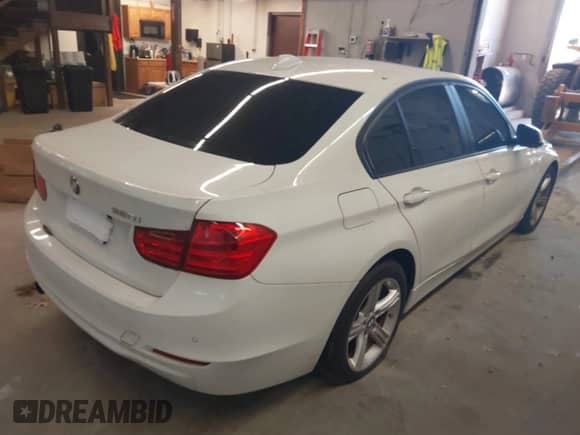 2014 BMW 3 Series 320i with VIN WBA3B1C5XEP680800, listed as a IAAI auction lot 42557241 with 120,425 mi miles and . Bid and sale history available at DreamBid. Image 4.