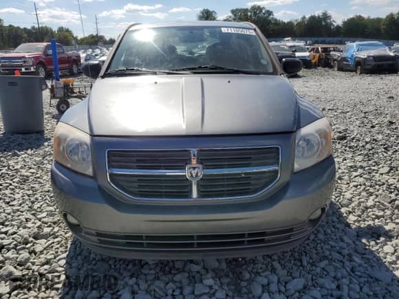 2011 Dodge Caliber Heat z VIN 1B3CB5HA6BD262474, wystawiony jako Copart lot #71105075 z przebiegiem 118 429 mil mil oraz Szkoda całkowita • Salvage title. Historia ofert i sprzedaży dostępna na DreamBid. Obrazek 5.