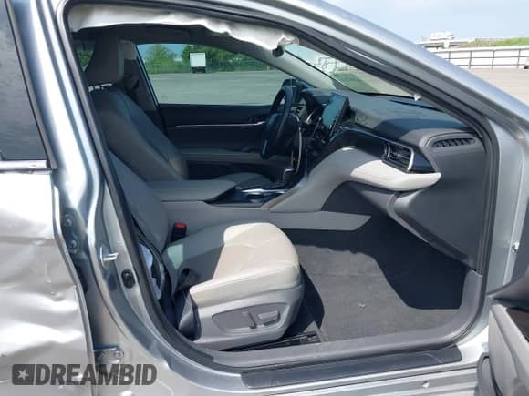 2021 Toyota Camry Hybrid XLE with VIN 4T1F31AK5MU565376, listed as a IAAI auction lot 42687616 with 57,880 mi miles and . Bid and sale history available at DreamBid. Image 5.