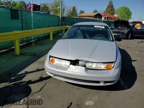 2001 Saturn SL z VIN 1G8ZH52891Z317279, wystawiony jako Copart lot #55163885 z przebiegiem 136 029 mil mil oraz Nie do naprawy • Non repairable. Historia ofert i sprzedaży dostępna na DreamBid. Obrazek 13.