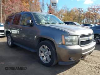 2011 Chevrolet Tahoe LS with VIN 1GNSCAE09BR332443, listed as a IAAI auction lot 43584802 with 190,336 mi miles and . Bid and sale history available at DreamBid. Image 1.
