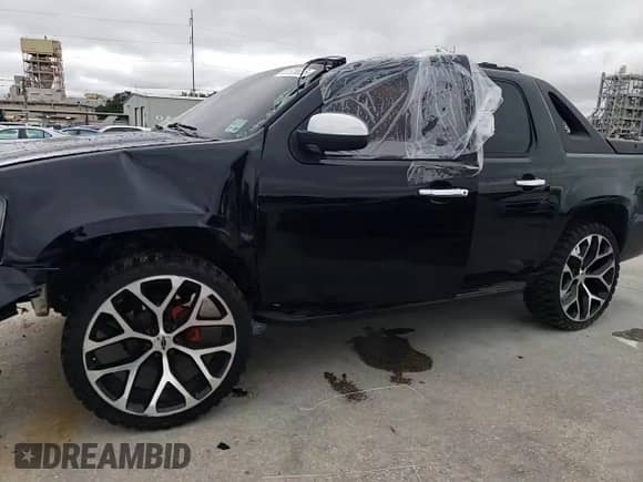 2009 Chevrolet Avalanche 1LT with VIN 3GNEC22J79G164005, listed as a Copart auction lot 52026655 with Not provided miles and Salvage title. Bid and sale history available at DreamBid. Image 11.