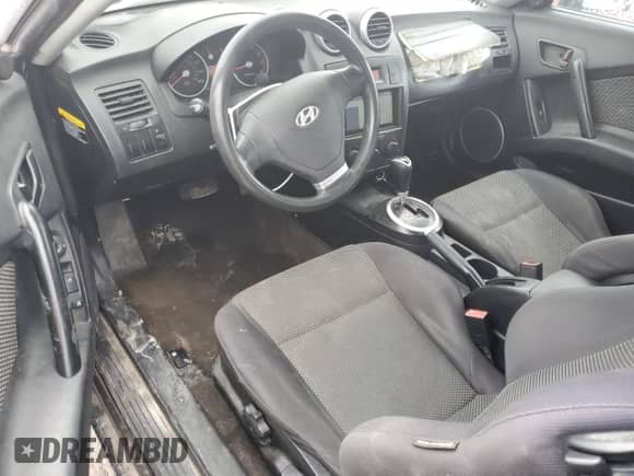 2006 Hyundai Tiburon GS с VIN KMHHM65D86U227276, выставлен на аукционе Copart как лот 44562695 с пробегом 187 017 миль миль и Списание • Salvage title. История ставок и продаж доступна на DreamBid. Изображение 8.
