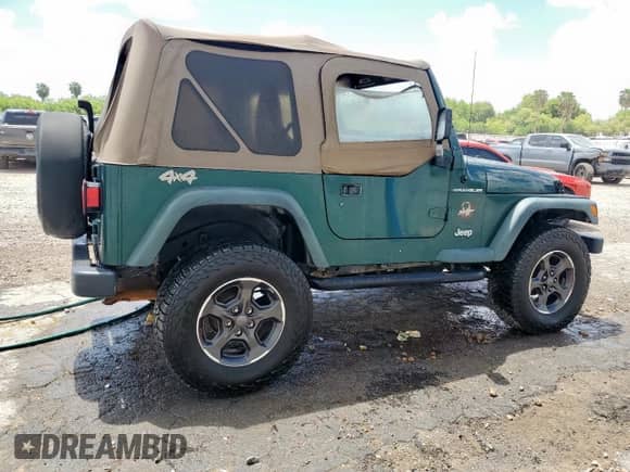 2000 Jeep Wrangler SE with VIN 1J4FA29P2YP800721, listed as a Copart auction lot 67490145 with 128,182 mi miles and Clean title. Bid and sale history available at DreamBid. Image 3.