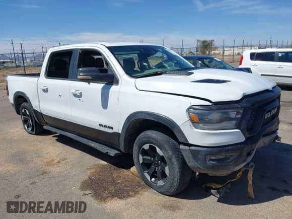 2022 Ram 1500 Rebel z VIN 1C6SRFLT4NN357352, wystawiony jako IAAI lot #41881613 z przebiegiem 31 285 mil mil oraz . Historia ofert i sprzedaży dostępna na DreamBid. Obrazek 1.