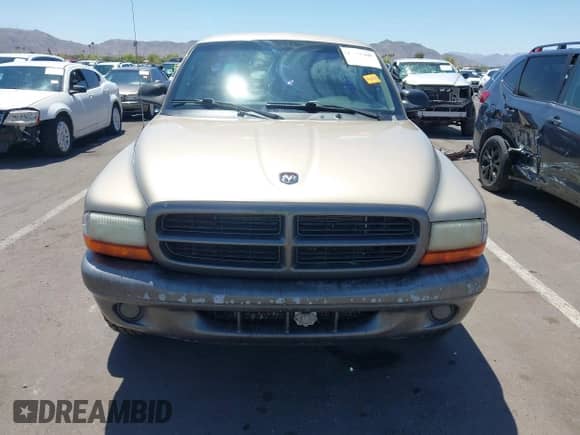 2002 Dodge Dakota z VIN 1B7FL16X72S642881, wystawiony jako IAAI lot #42153560 z przebiegiem 220 917 mil mil oraz . Historia ofert i sprzedaży dostępna na DreamBid. Obrazek 6.