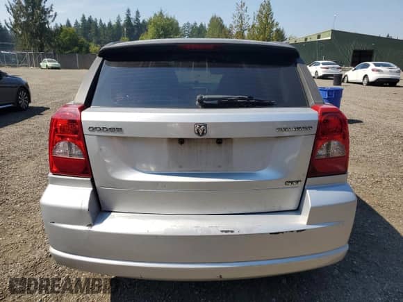 2010 Dodge Caliber SXT with VIN 1B3CB4HA5AD530259, listed as a Copart auction lot 70313555 with 184,173 mi miles and Salvage title. Bid and sale history available at DreamBid. Image 6.