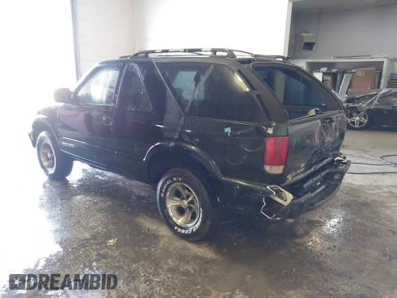 2001 Chevrolet Blazer LS with VIN 1GNCS18W51K260297, listed as a IAAI auction lot 41697909 with 144,564 mi miles and . Bid and sale history available at DreamBid. Image 3.